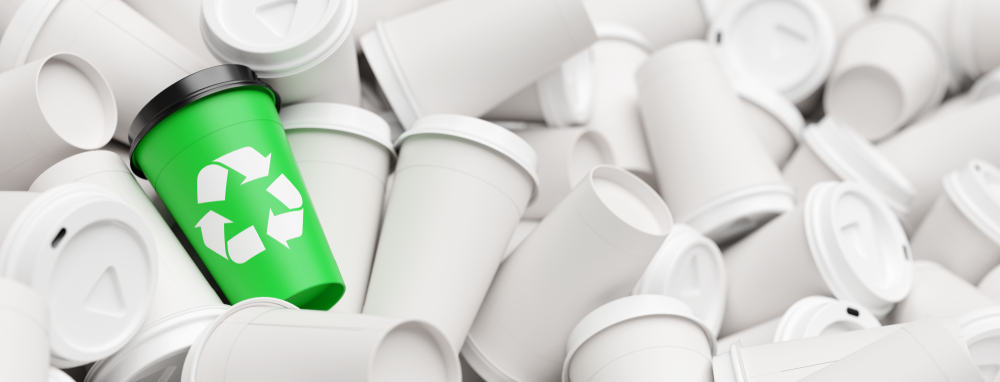a,mug,with,a,green,recycling,logo,stands,out,from